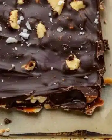 A delightful plate of homemade Chocolate Date Bark with nuts and cocoa.