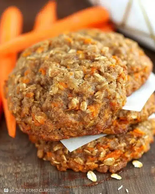 Healthy Carrot Cake Oatmeal Cookies 2 Healthy carrot cake oatmeal cookies on a white plate with icing