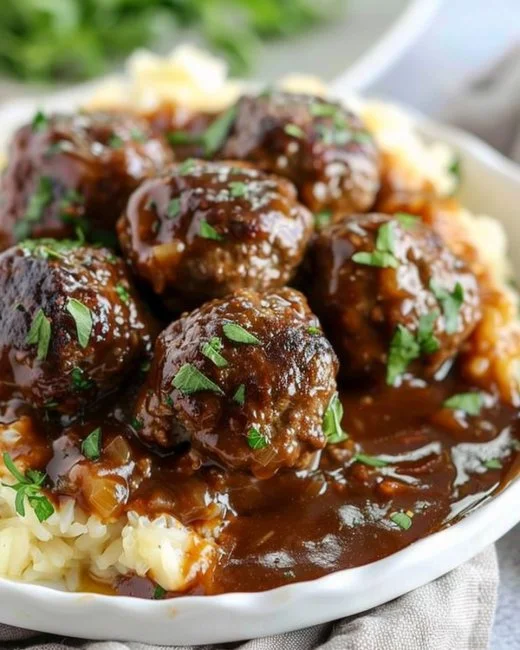 Slow Cooker Salisbury Steak Meatballs served with mashed potatoes and gravy
