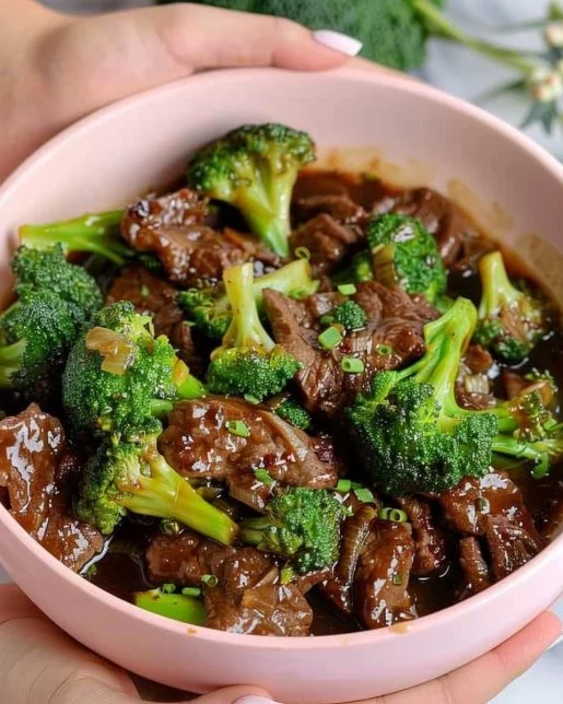 Beef and Broccoli Stir-Fry 2 Delicious Beef and Broccoli Stir-Fry served in a bowl with vibrant colors.