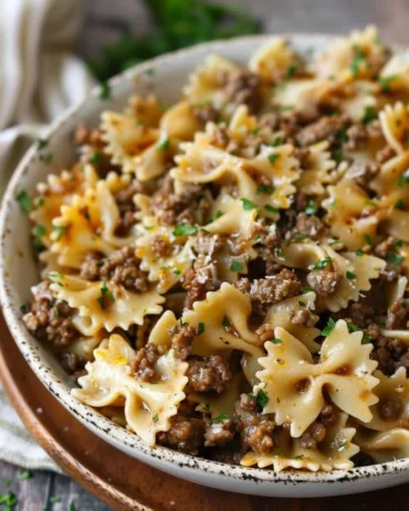 Delicious Garlic Butter Bowtie Pasta with Ground Beef served in a bowl