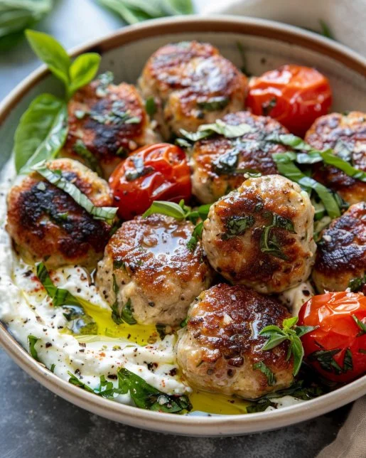 Greek Turkey Meatballs 2 Greek Turkey Meatballs served with fresh herbs and yogurt sauce