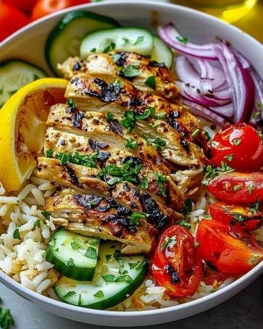 Mediterranean Chicken and Rice Bowl 2 Mediterranean chicken and rice bowl with fresh herbs and veggies