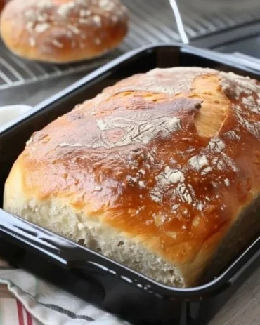 Freshly baked 5-minute bread on a wooden board, ready to serve.