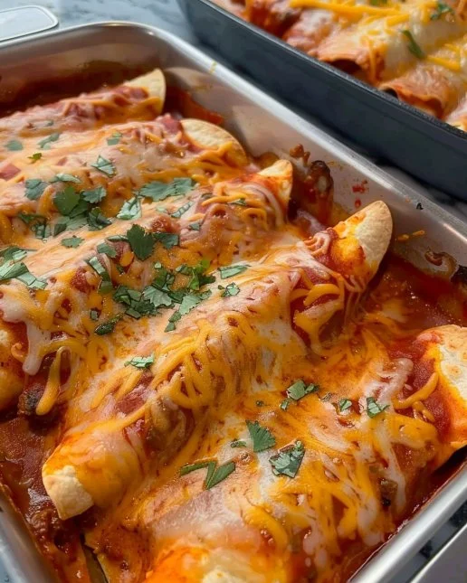 Delicious ground beef enchiladas topped with cheese and fresh ingredients